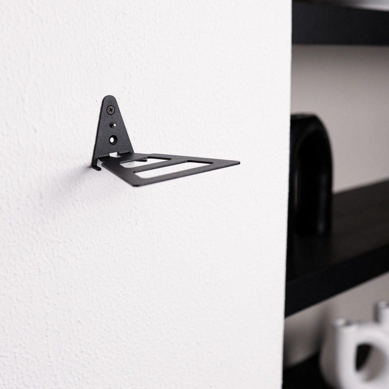 Minimal metal floating wall shelf with handmade steel construction and powder-coated finish