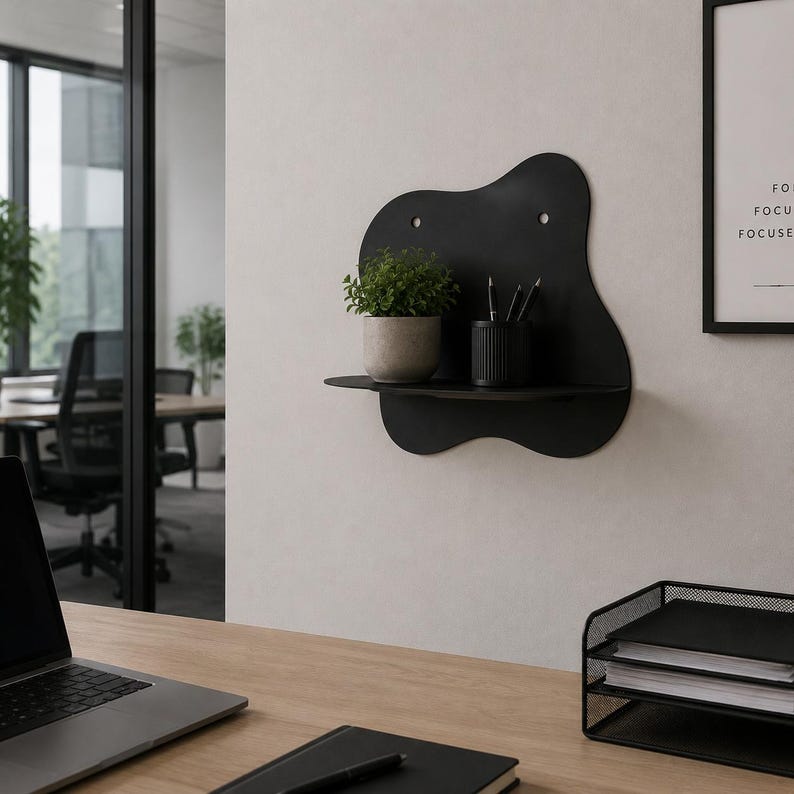 Abstract metal floating wall shelf with wavy back panel displaying a small vase and decorative dish