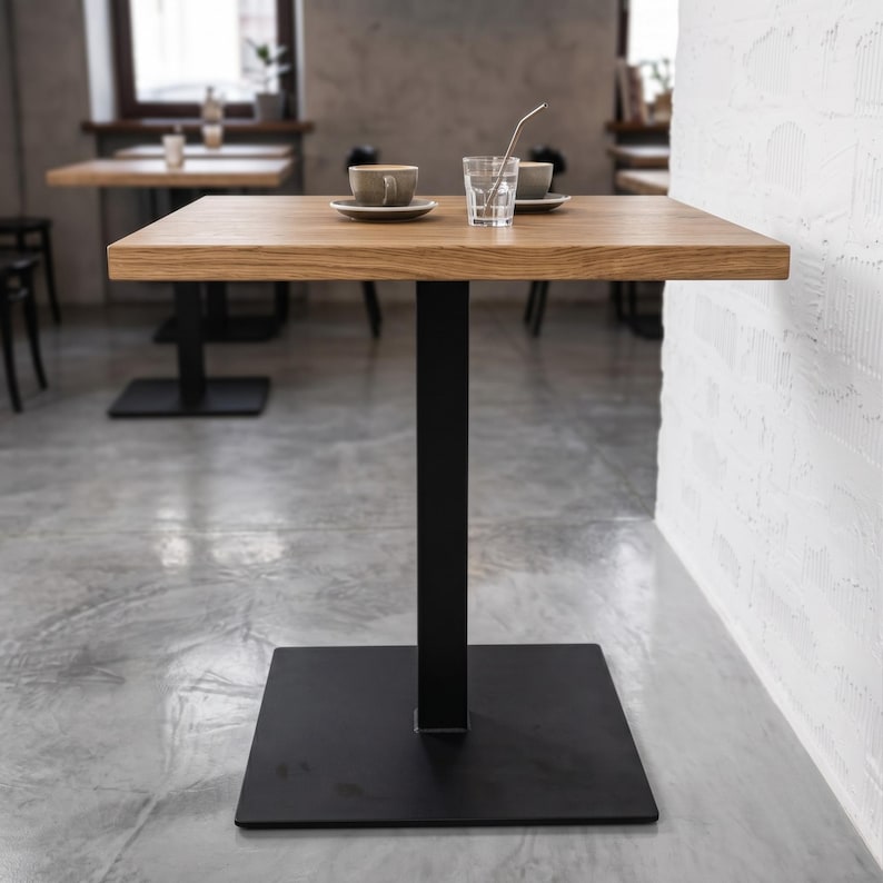 Black industrial metal pedestal table base with square bottom plate, rectangular steel column and cross-shaped top support