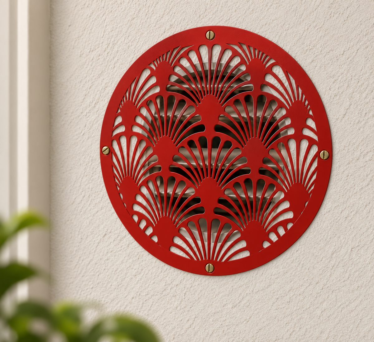 Round Art Deco metal vent cover with decorative fan pattern