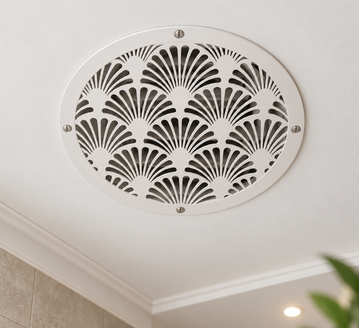 Round Art Deco metal vent cover with decorative fan pattern