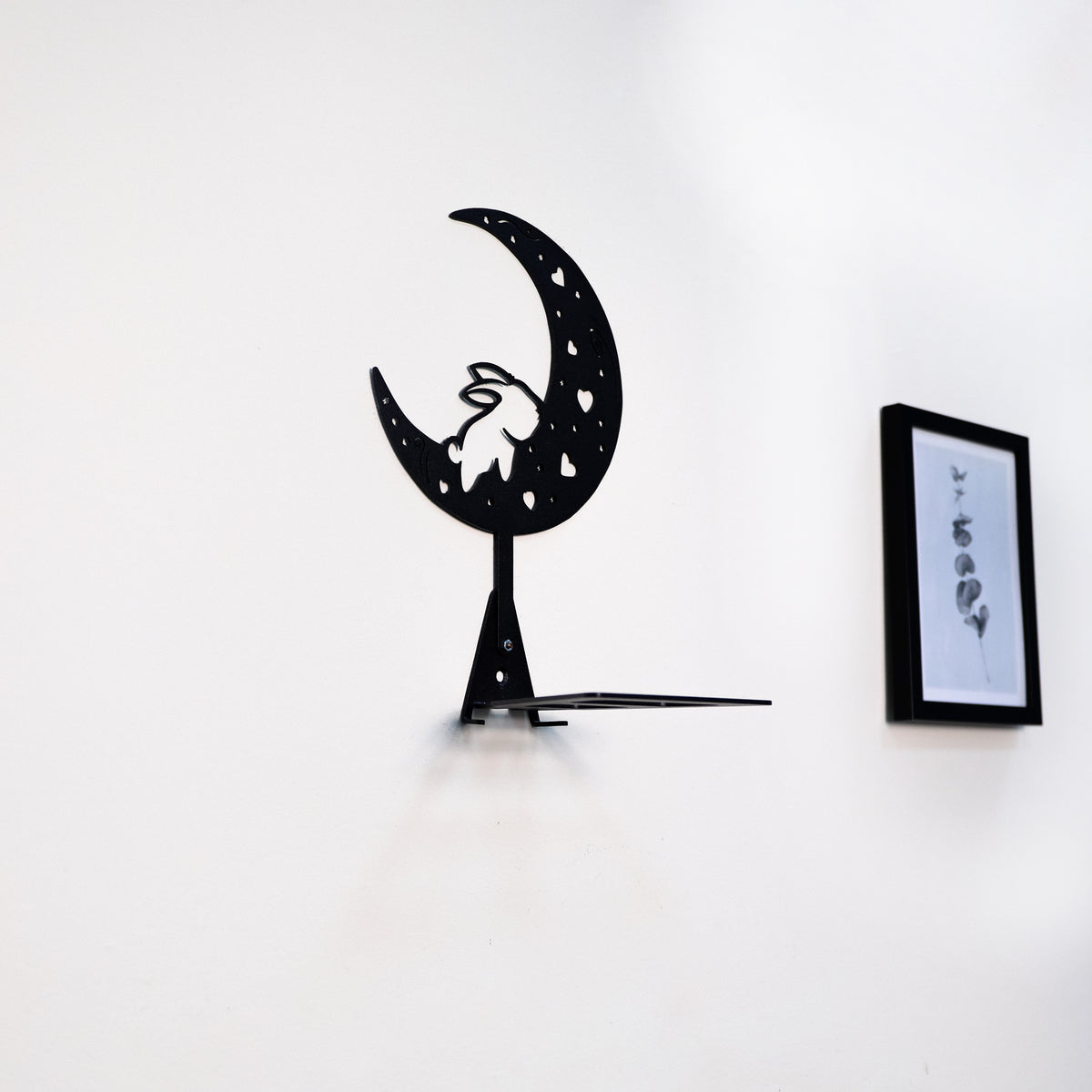 Handmade moon rabbit metal wall shelf with celestial silhouette design. A unique floating shelf for modern, boho, and fantasy interiors.