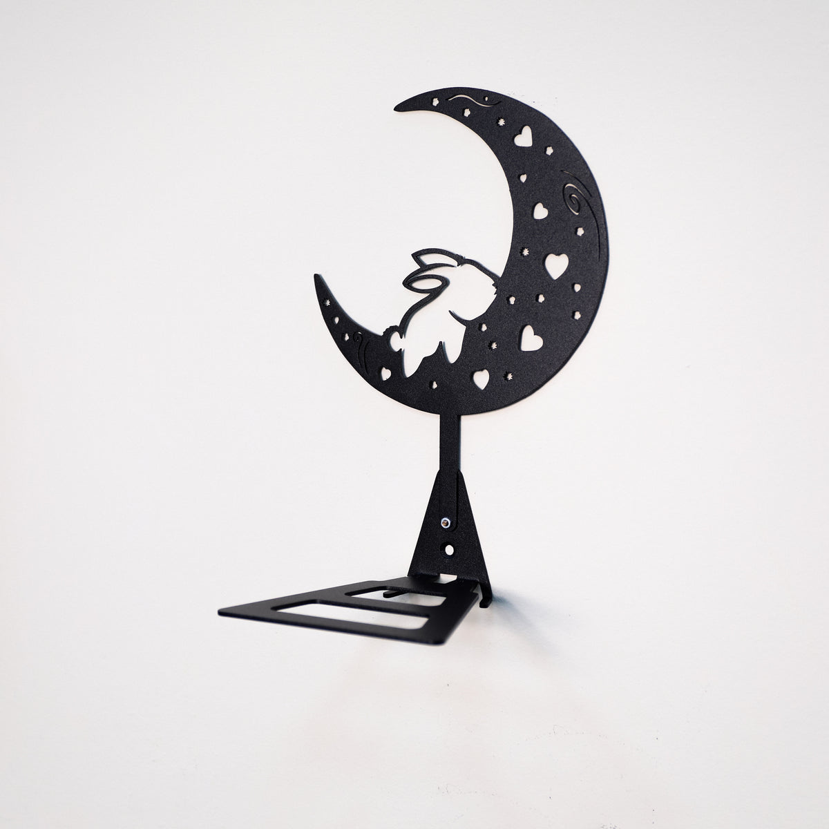 Handmade moon rabbit metal wall shelf with celestial silhouette design. A unique floating shelf for modern, boho, and fantasy interiors.