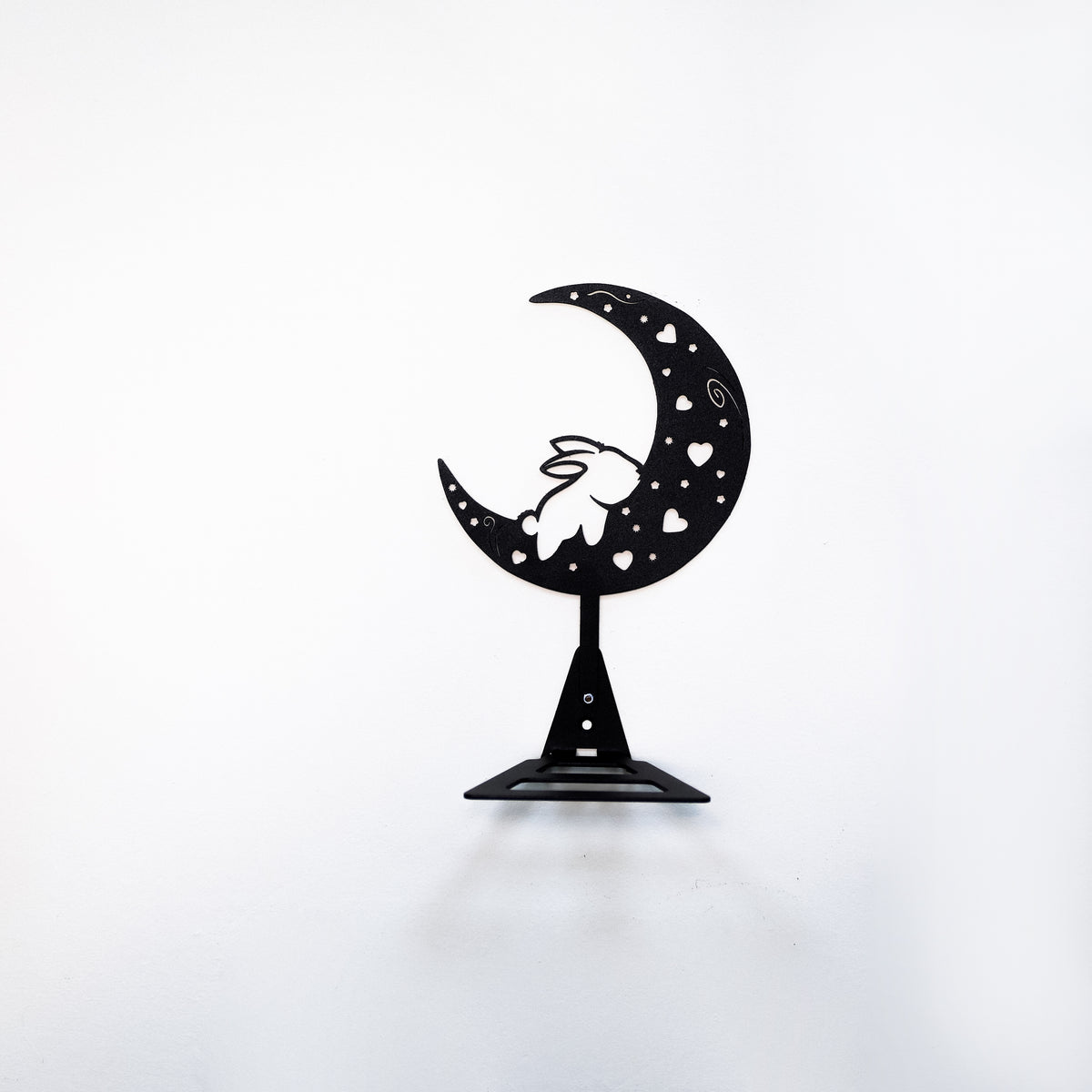 Handmade moon rabbit metal wall shelf with celestial silhouette design. A unique floating shelf for modern, boho, and fantasy interiors.