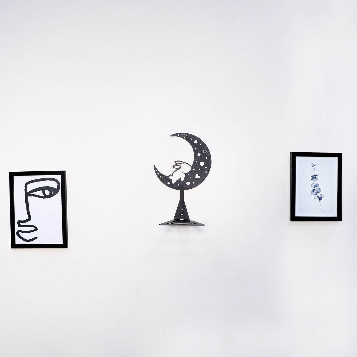 Handmade moon rabbit metal wall shelf with celestial silhouette design. A unique floating shelf for modern, boho, and fantasy interiors.