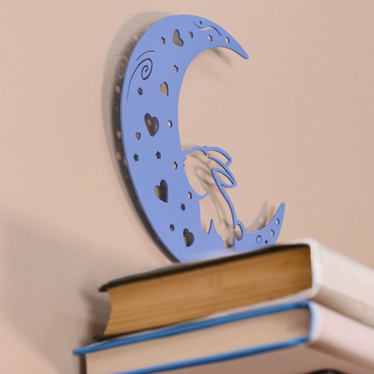 Handmade moon rabbit metal wall shelf with celestial silhouette design. A unique floating shelf for modern, boho, and fantasy interiors.