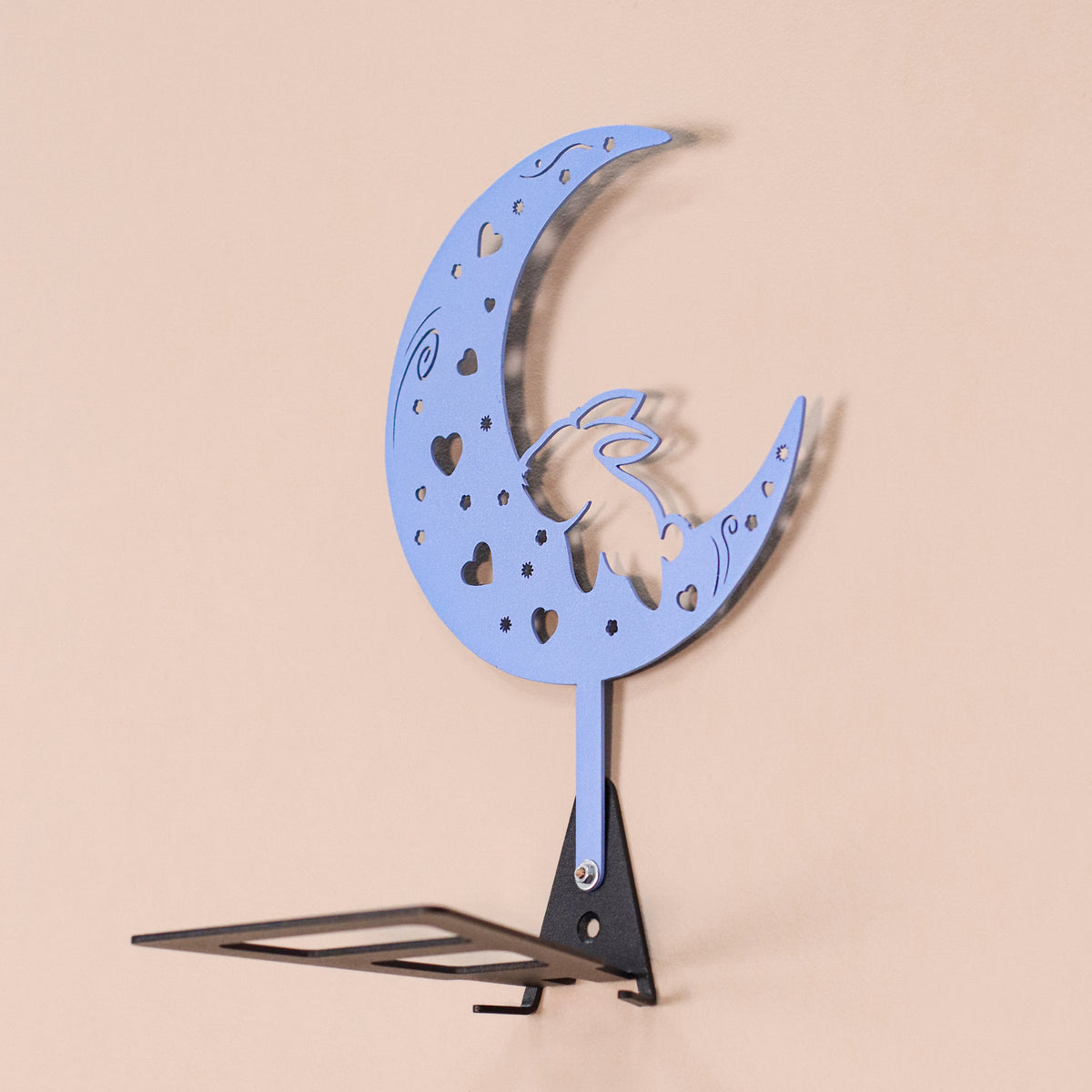 Handmade moon rabbit metal wall shelf with celestial silhouette design. A unique floating shelf for modern, boho, and fantasy interiors.