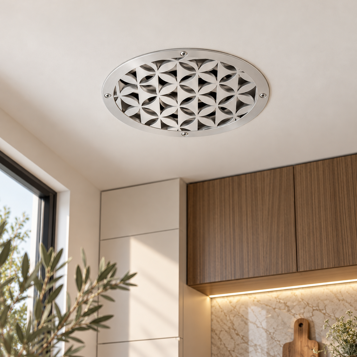 Round geometric metal vent cover with repeating modern pattern