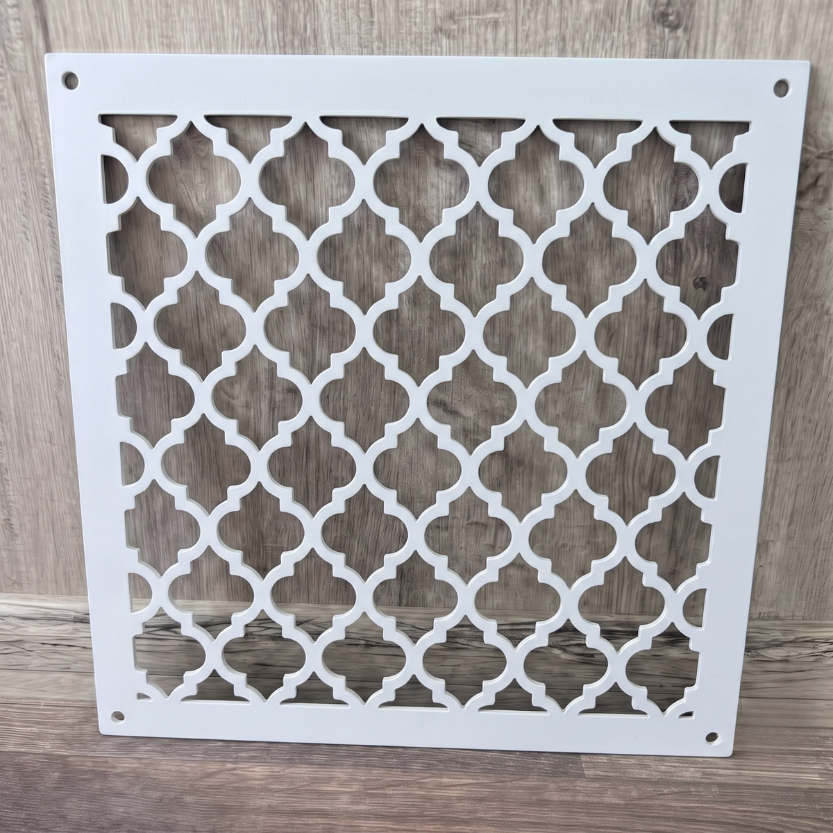 Large Victorian metal vent cover with decorative ornamental laser-cut grille pattern
