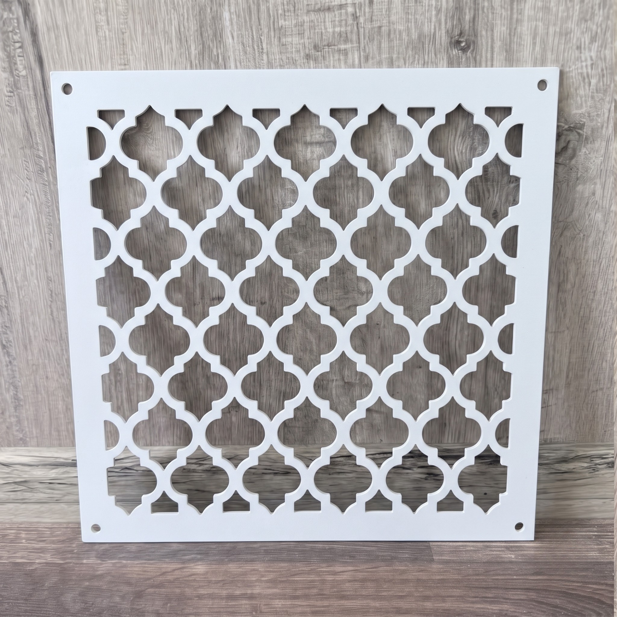 Large Victorian metal vent cover with decorative ornamental laser-cut grille pattern