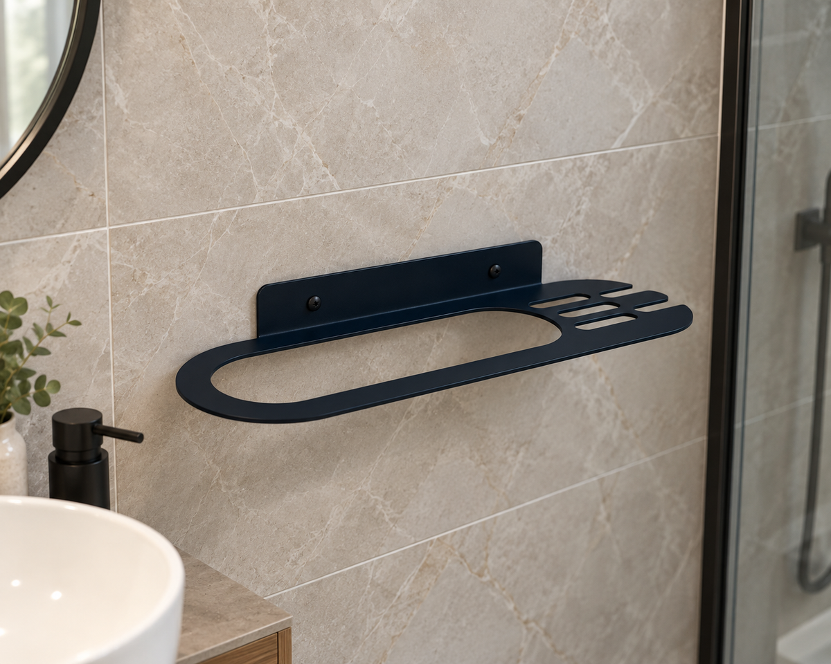 Black metal bathroom wall shelf with oval storage opening and integrated towel holder