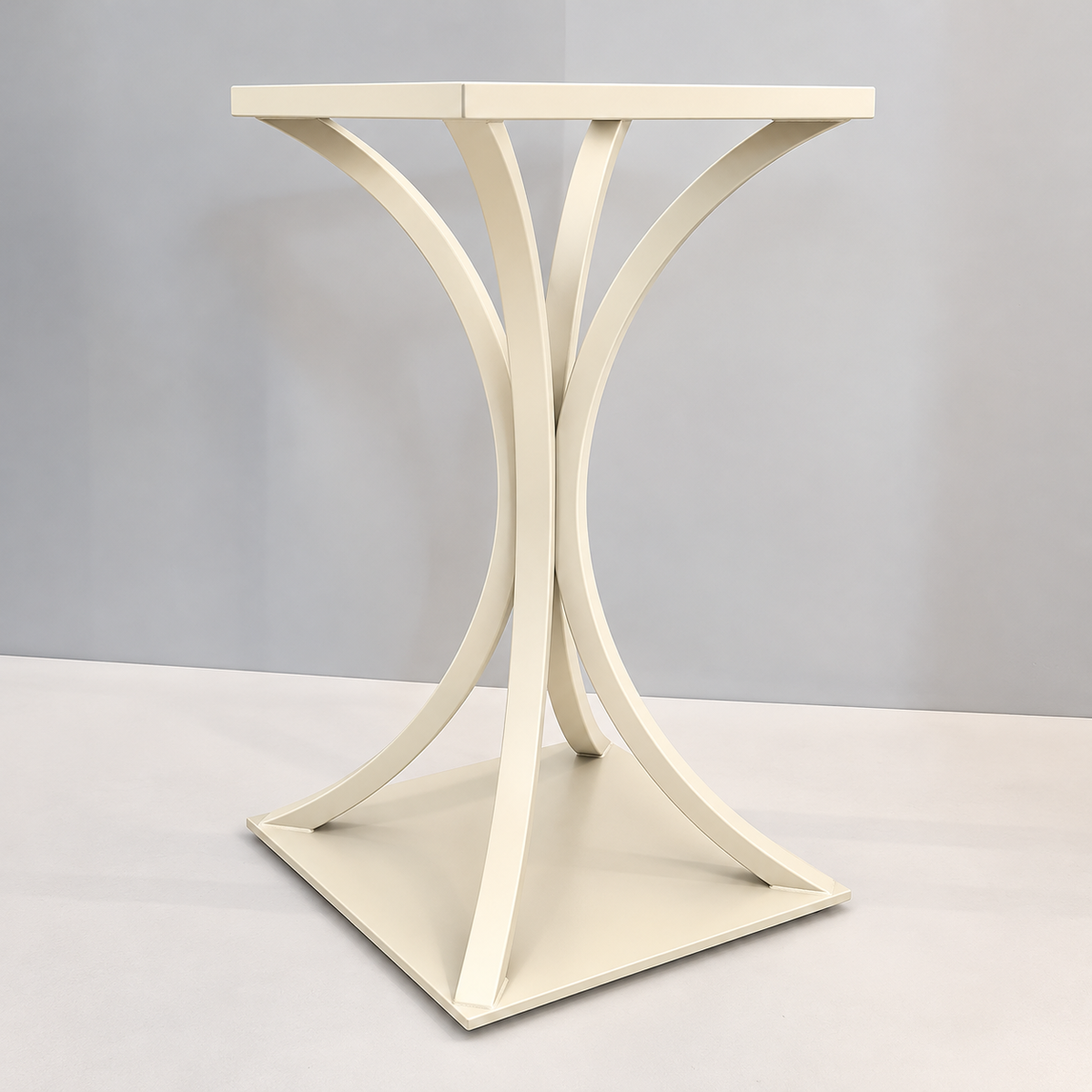 An off-white wooden table base with a square top and four elegantly curved legs forming an X-shape, set against a neutral gray studio background.