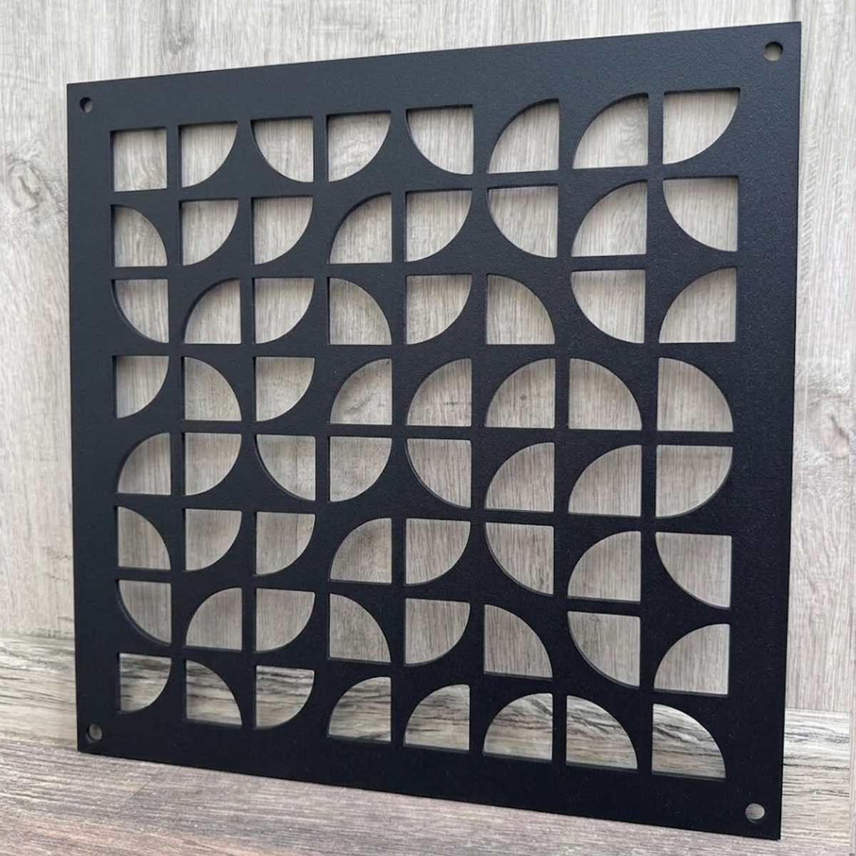 Geometric decorative metal vent cover with modern laser-cut patterns