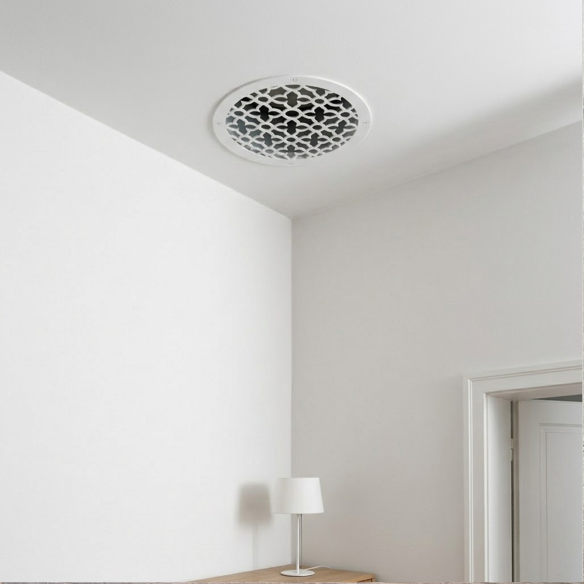 Round decorative metal vent cover with custom laser-cut pattern