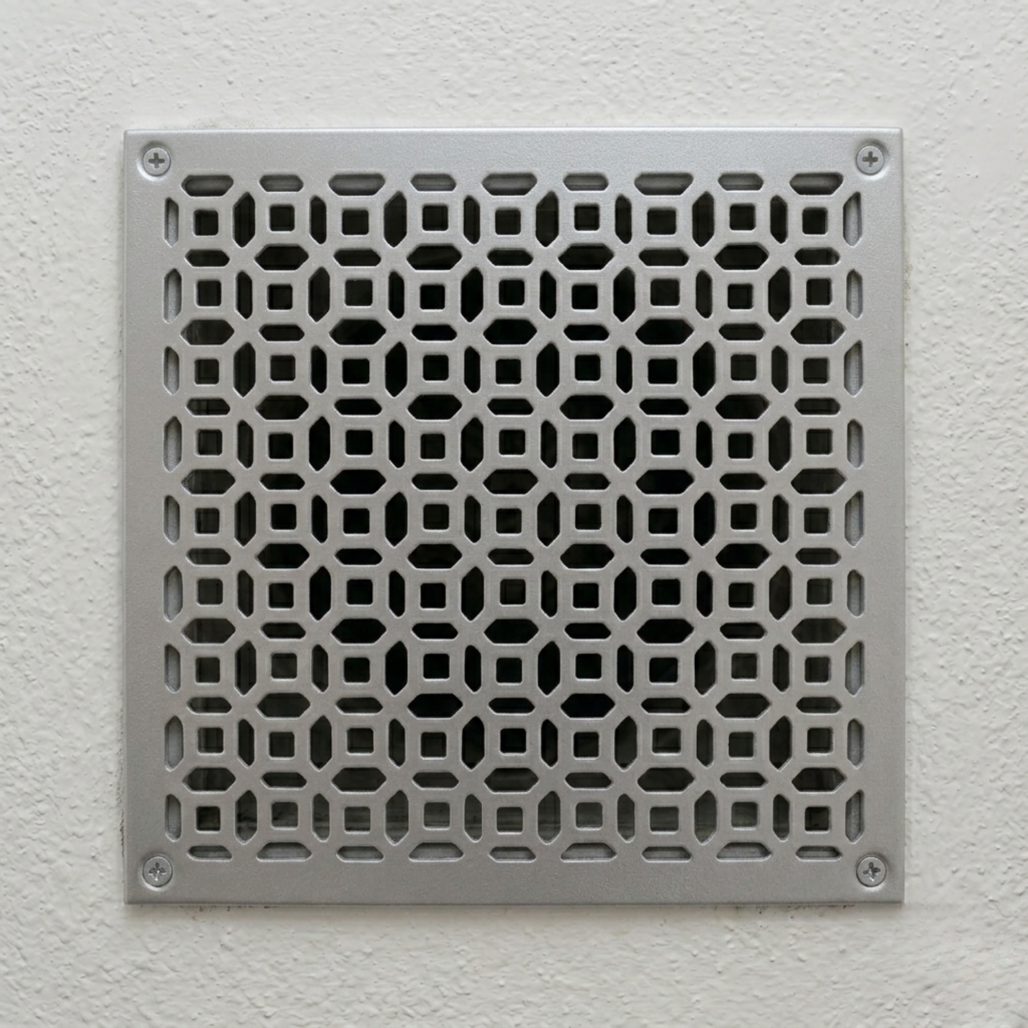 Modern geometric metal vent cover with custom laser-cut steel HVAC grille