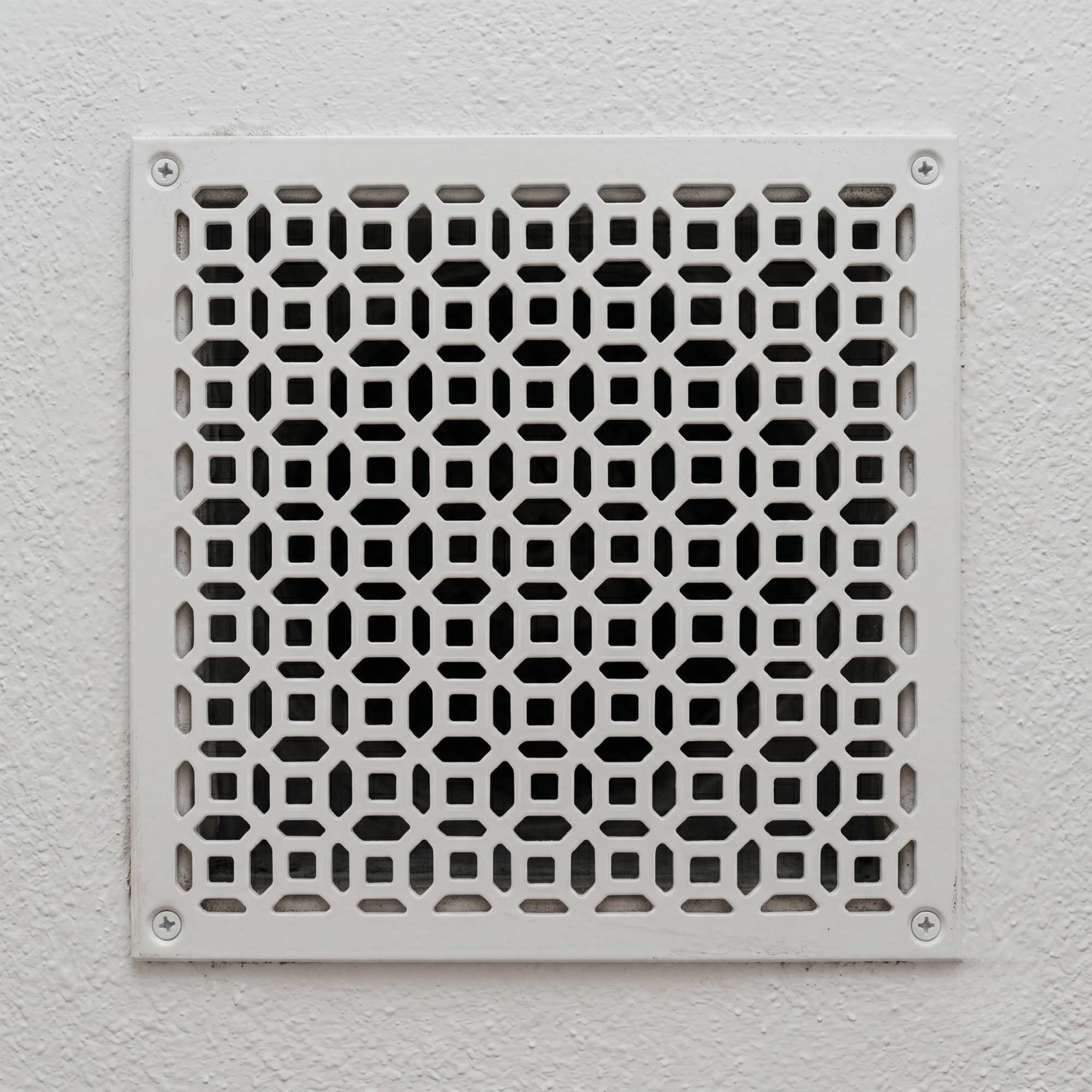 Large geometric metal vent cover with custom laser-cut steel HVAC grille
